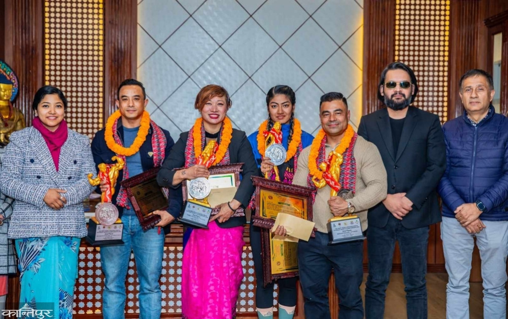 Silver medal winners of bodybuilding championships are honored with cash