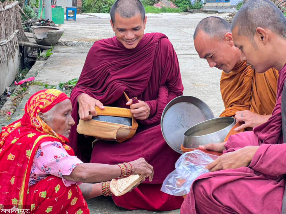 Thai monks in a rain forest doing alms in Lumbini