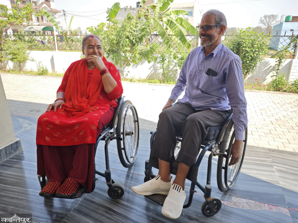A couple with spinal cord paralysis working as a model