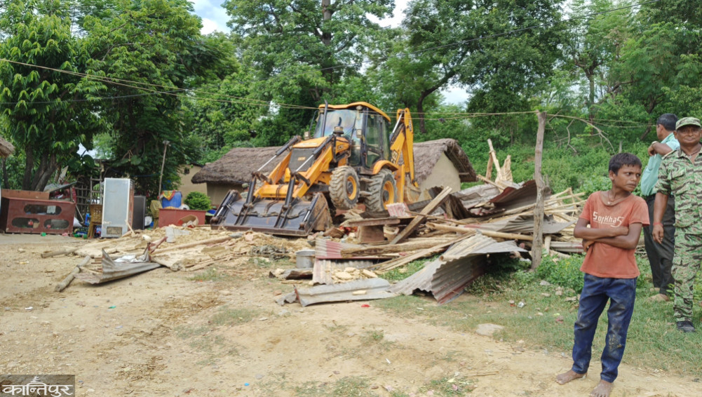 The dozer ran over the structure in the forest land