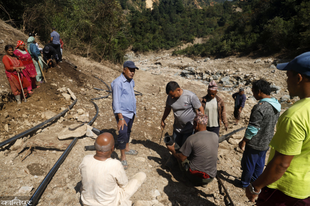 Shramdan to build a water spring that was swept away by the flood
