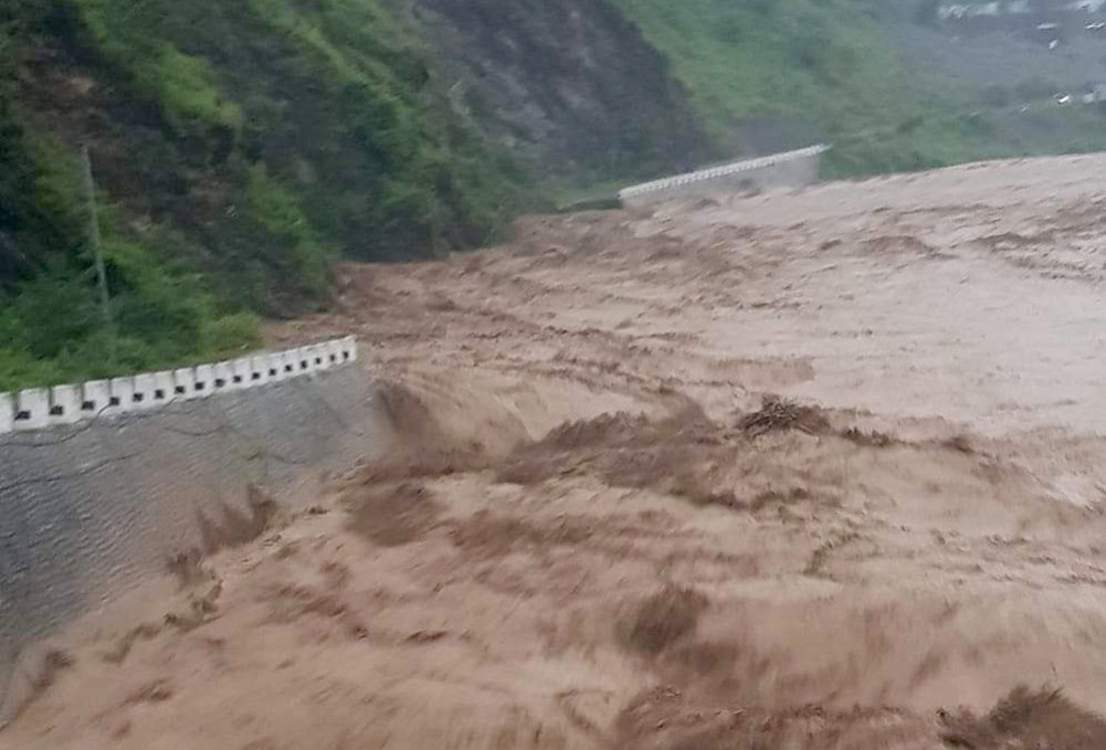Road of BP highway washed away by Roshi flood, traffic stopped