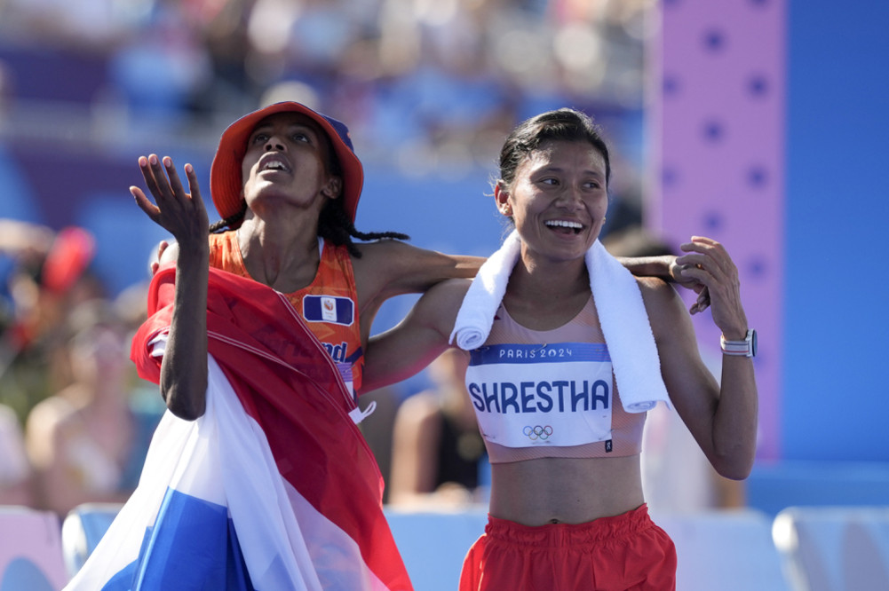 A marathon glow on Santoshi and Siphon's face