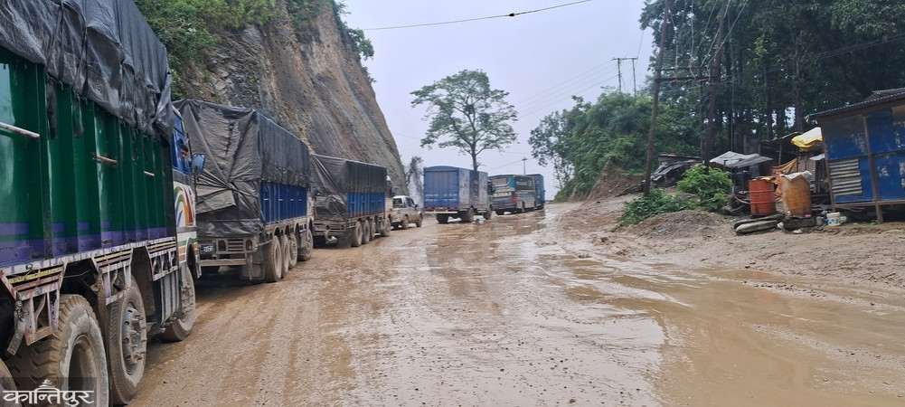 Muddy road in Daunne, causing hardship for commuters