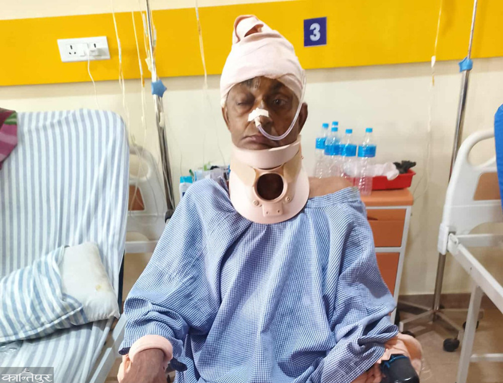 Dev, who should have been discharged, remains in the hospital due to lack of medical expenses.