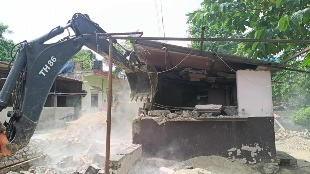 Ramgram Municipality's dozer on the encroached structure