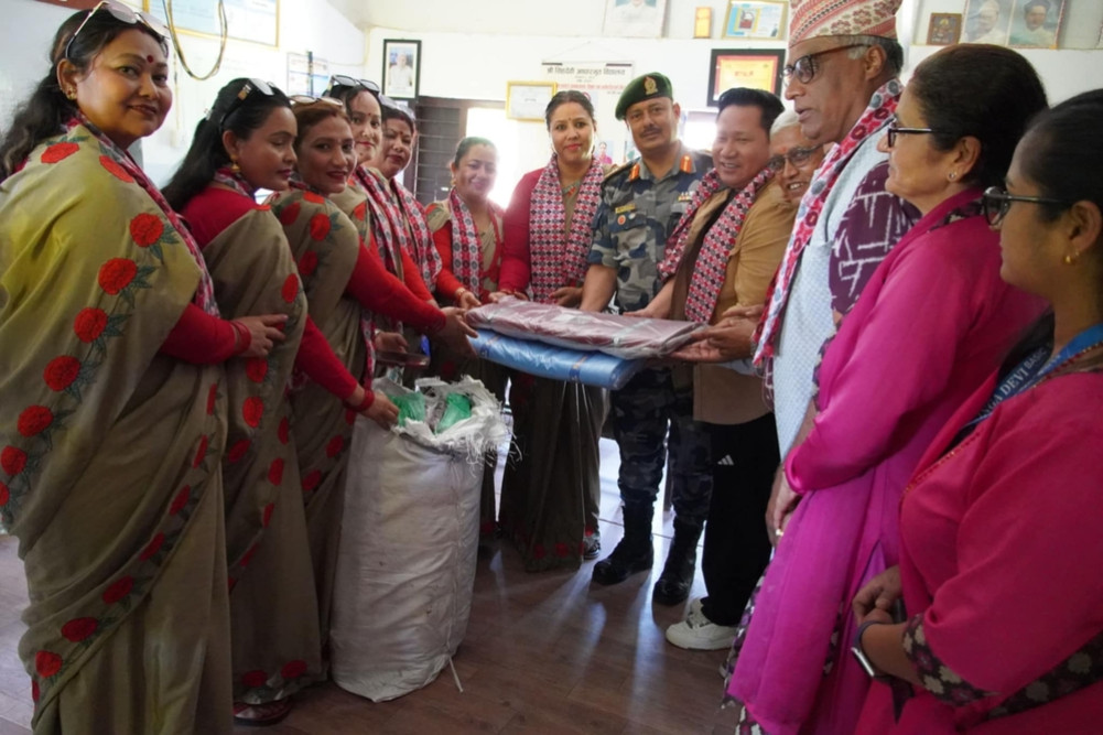 Distribution of uniforms to students by Armed Police Family Women's Association