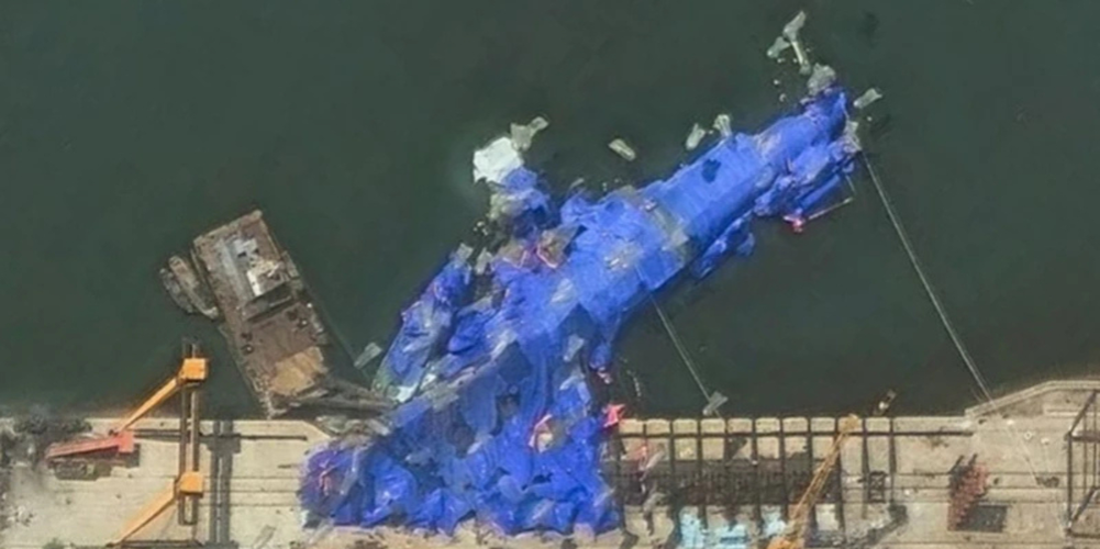 Three North Korean officials were detained after the warship crashed during the test