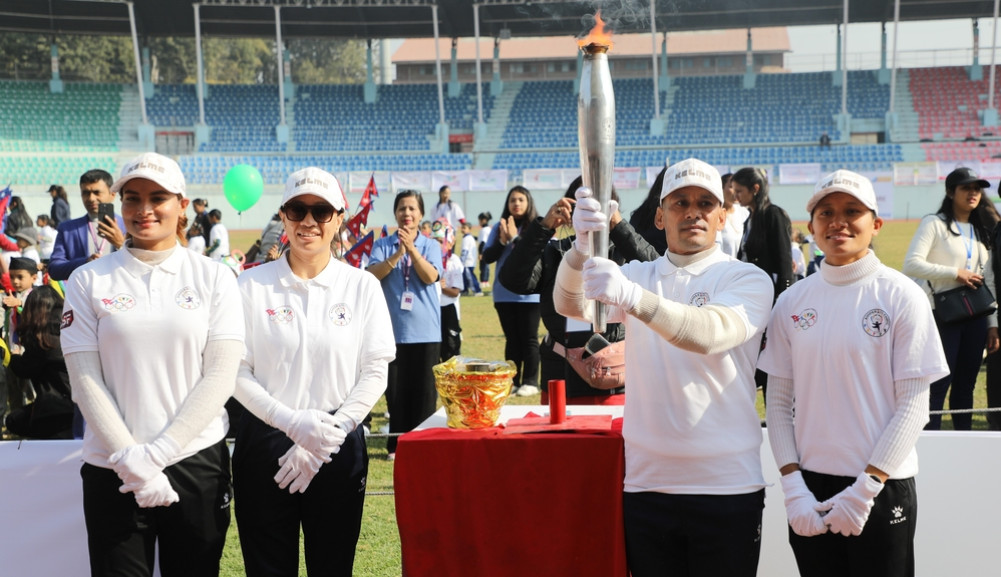 Olympians carry torch at Kinder Olympics