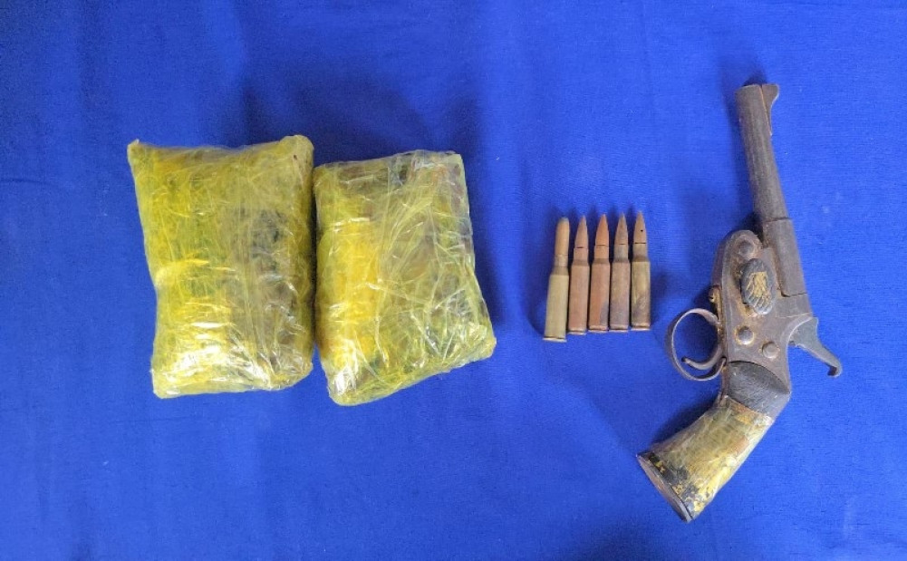 Katuva pistol and opium seized from Raksirang
