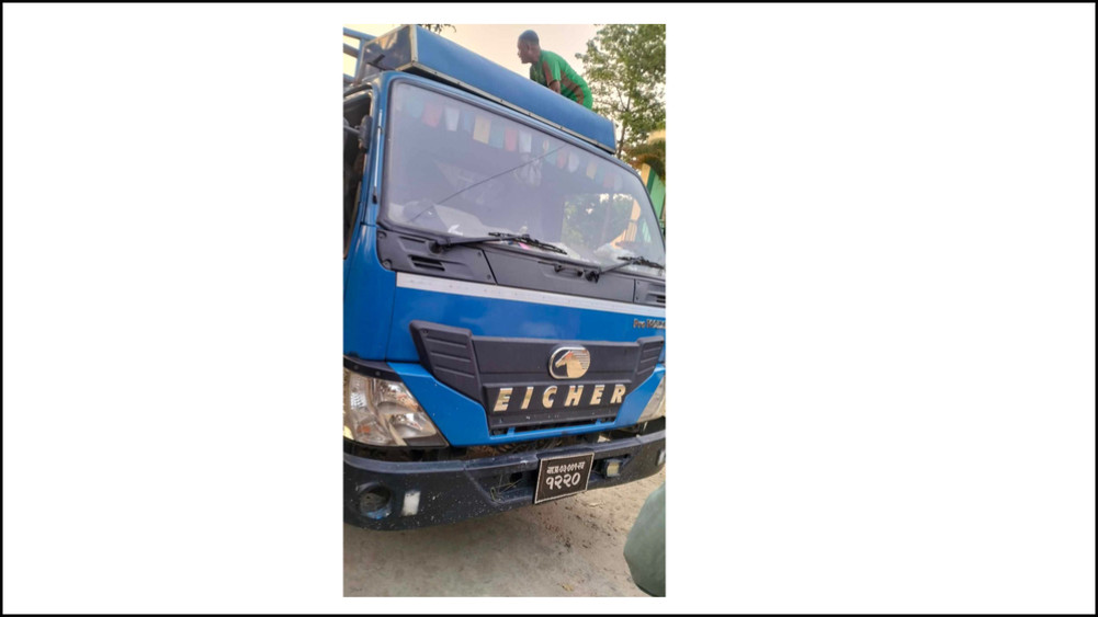 A truck with cows under control
