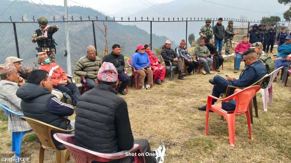 Security personnel's verbal consultation with voters in Dolakha