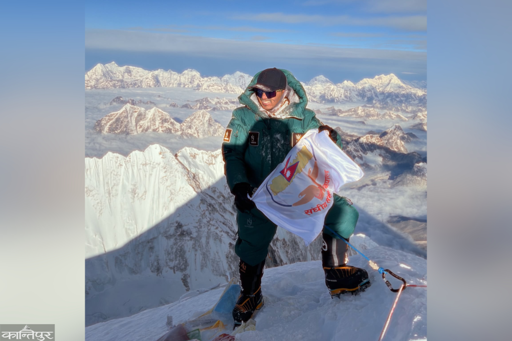 MP Mingma Gyabu Sherpa reaches the summit of Mount Everest carrying the flag of the House of Representatives