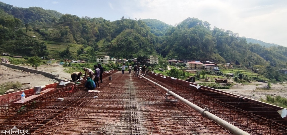 Chepang village rejoices as bridge built in place where crossing a river would cost lives