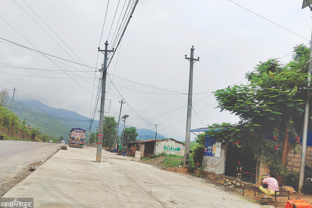 Fallen electricity poles obstruct road expansion