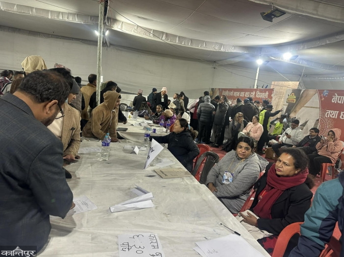 Crowds of people collecting and filling out nomination registration forms