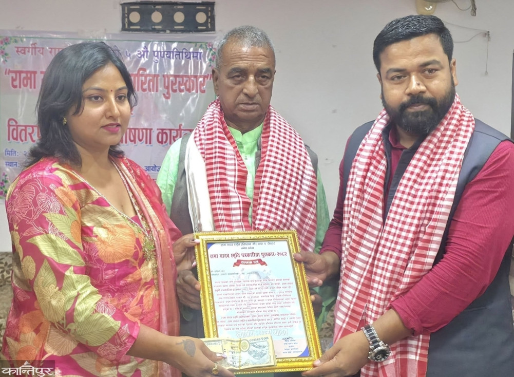 Journalist duo Jha and Pokharel honored