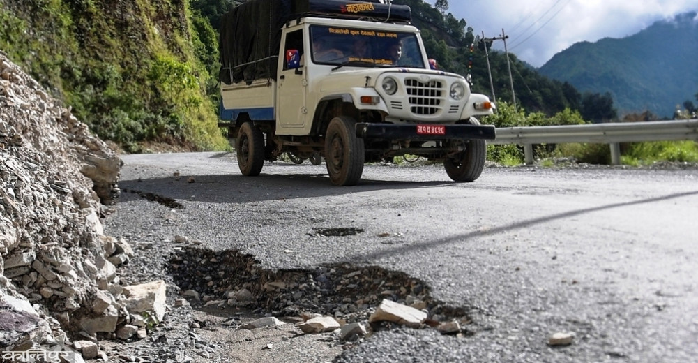 Failure to maintain roadside drains results in damage to the road itself