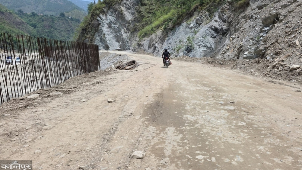 An eight-meter-high wall rises from the river on the collapsed BP Highway