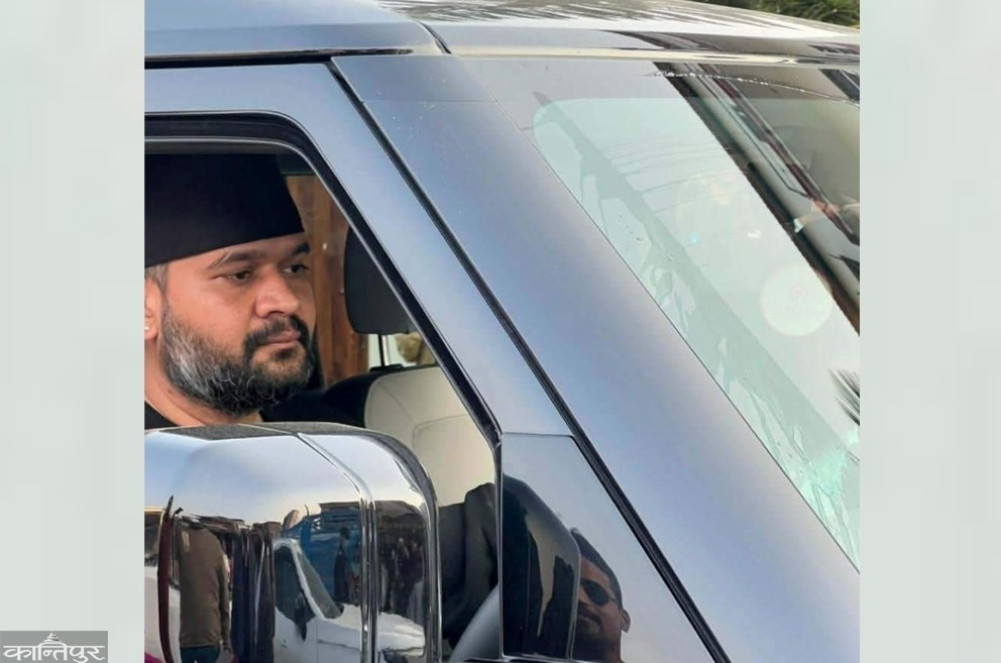 Whose car is Balendra riding in?