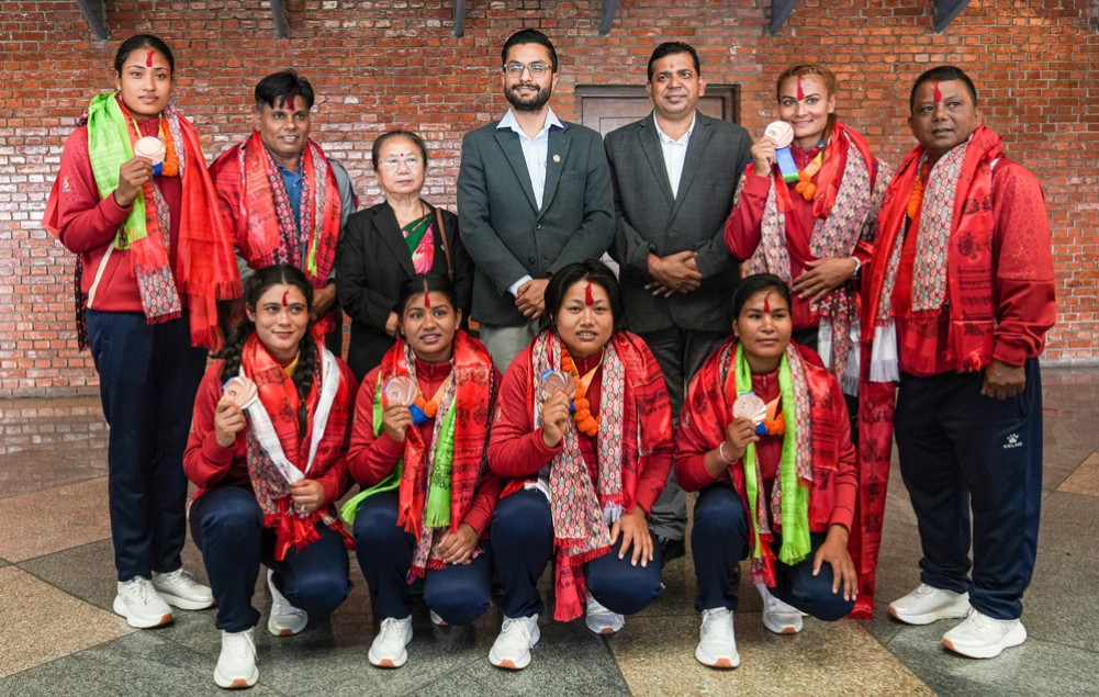 Minister Pokharel arrives at the airport to welcome the medal winners