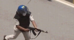 Police officer suspended for firing AK-47 at student protesters in Bihar