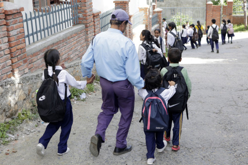 Children from the holding center travel two hours by vehicle to reach school