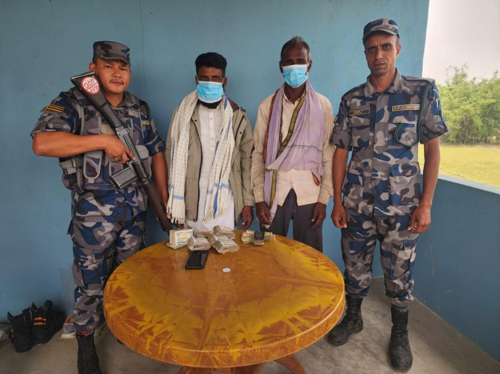 Two arrested with undisclosed money