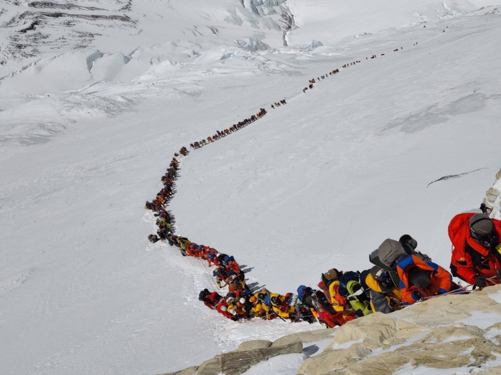 The debate over the crowd on Mount Everest has been reignited after 270 people climbed the mountain in a single day.