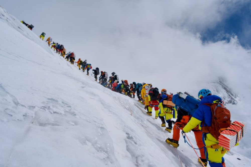 1,080 people successfully climb Mount Everest, setting a new record