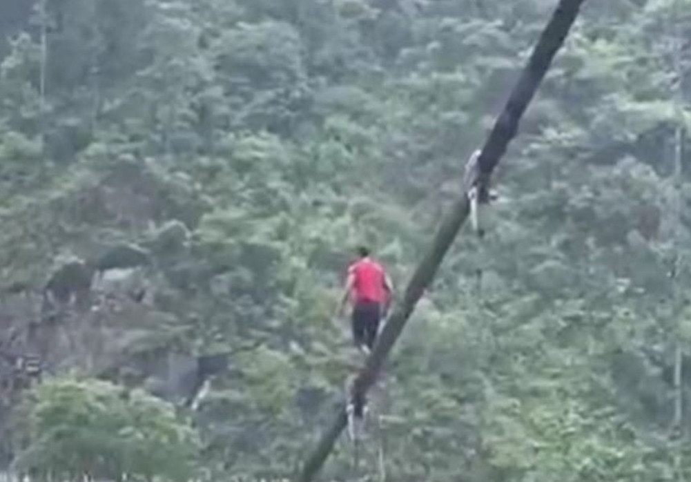 Rescue of young man walking on a stick on Muglin Bridge