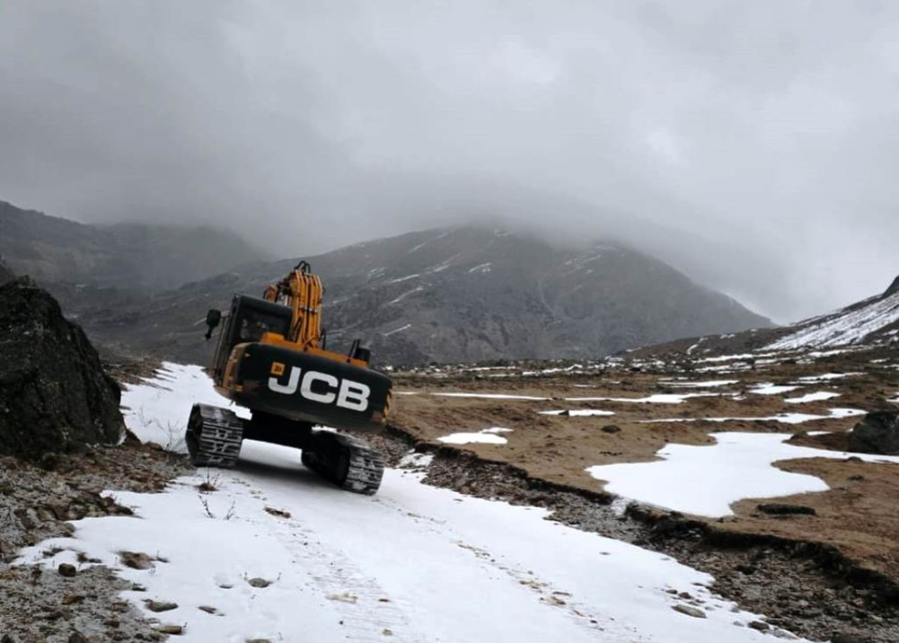 Voters, staff, and election materials return by helicopter after shoveling snow