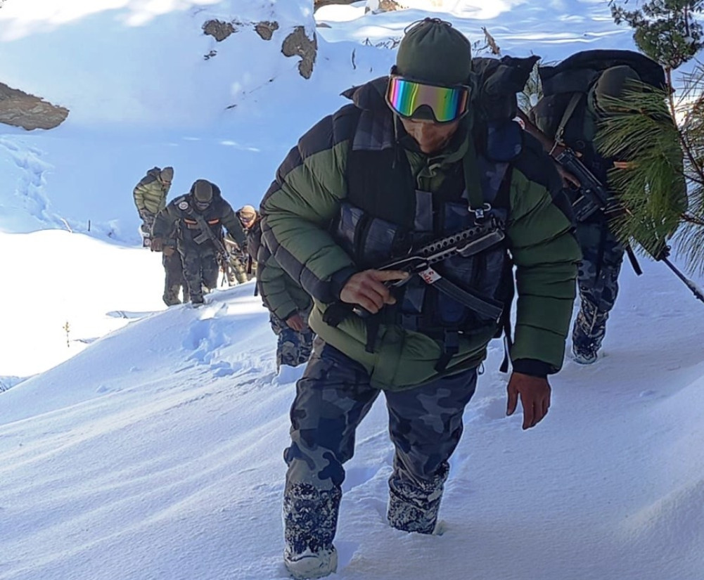 Armed forces guard the snow-covered Chhangru
